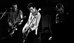 Mick Jones, Joe Strummer and Paul Simonon on stage.