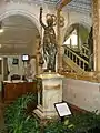 Monumental conical pendulum clock by Eugène Farcot, sculpture by Albert-Ernest Carrier-Belleuse. Purchased at the 1878 Paris world fair, in vestibule.