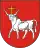 A coat of arms depicting a white bull with an angry expression and a golden cross protruding from its head all on a red background