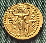 Three-faced four-armed Oesho with attributes, often identified with Shiva, on a coin of Huvishka.