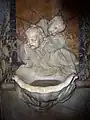 Holy water font in Santa Maria Maddalena, Rome, Italy