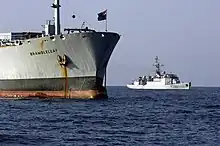 A D'Estienne d'Orves-class aviso near RFA Brambleleaf prior to performing a "visit, board, search and seizure" operation