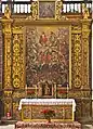 Altar in Iglesia de la Concepción, Santa Cruz de Tenerife. Top: Trinity; Mid-top: Mary, John the Baptist, Holy family; Mid: archangel Michael; Lower: Saints interceding; Bottom: souls undergoing fiery purgation, still with worldly attachments (shackles) and venial sins (snakes).