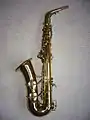 Left side view of Conn 6M "Lady Face" alto saxophone showing distinctive underslung octave key