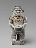 Cosmetic container; 525–404 BC; faience; height: 9.2 cm, width: 4.4 cm; Metropolitan Museum of Art