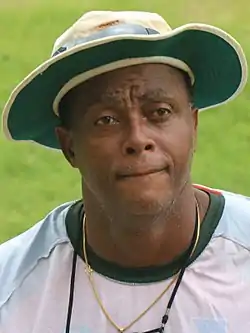 Courtney Walsh wearing a cricket cap