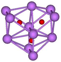 The stick and ball diagram shows three regular octahedra, which are connected to the next one by one surface and the last one shares one surface with the first. All three have one edge in common. All eleven vertices are purple spheres representing caesium, and at the center of each octahedron is a small red sphere representing oxygen.