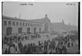 People waiting for the ocean liner RMS Mauretania (1906) at the Cunard Pier in New York City which was returning with American aviators and other troops from Europe after World War I on December 2, 1918