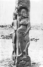 Yakshi under a stylized ashoka tree. Railing figure at Bharhut Stupa, 2nd century BC, India.