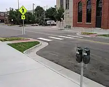 Curb extension at a mid-block pedestrian crossing