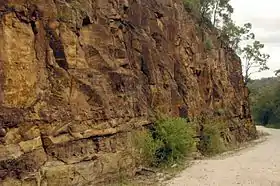 Cutting made by convict workers who would hammer a crowbar-like 'jumperbar' into the rock, fill the hole with gunpowder, plug the hole and ignite it; visible are metre-long 'half holes' that remained after the rock face was blown away