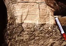 Layered white rock above brown rock