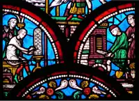 Detail from a 13th-century window in the Basilica of Saint-Quentin depicting the creation of a stained-glass window in Middle Ages.