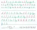 Handwritten cursive alphabet with all lowercase letters followed by capitals and punctuation, with consonants in green and vowels in red