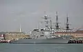 USS Mitscher at Portsmouth in October 2008 with the masts of HMS Victory in the background.