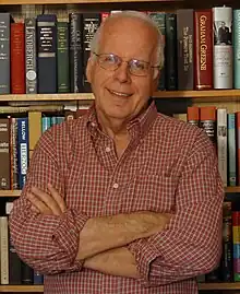 A photograph of an older man smiling