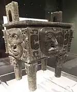 Da He ding (大禾方鼎; Dà Hé fāngdǐng); Shang dynasty; Hunan Museum. This ritual bronze is one of the very rare vessels that is decorated with human faces