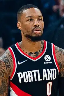 Damian Lillard in a black Portland jersey in a game for the Blazers in 2021