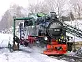 Steam engine 99 785 at the water crane in the Cranzahl station