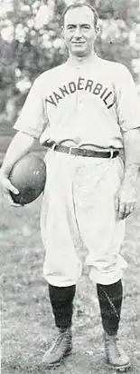 Dan McGugin, holding a football