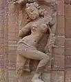 Sculpture of a dancer in the precincts of the temple