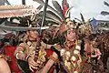 Dayak warrior parade in an event commemorating Youth Pledge Day at the Anjungan, West Kalimantan.