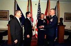 Secretary of Defense Donald Rumsfeld watches as General Richard B. Myers was sworn in as the 15th Chairman of the Joint Chiefs of Staff, October 1, 2001.