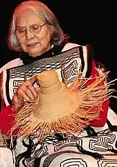 Woman sitting with woven basket