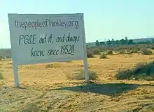 Hand-painted white billboard in the desert