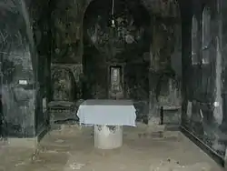 Burned and desecrated interior of the Devič. Note UÇK graffiti in the church apse.