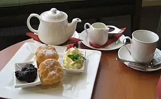 Cream tea: tea (c. 1660),  scones (Scots, 16th century), clotted cream, raspberry jam (11th century)