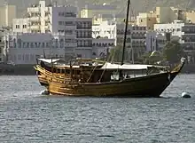 Muscat Harbor - A traditional Omani Dhow lies anchored in the Muscat Harbor (World's largest natural harbor)