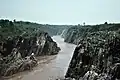 Downstream Narmada river flowing after the Dhuandhar Falls.