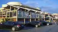 Cars outside a restaurant on the Dinevi Marina