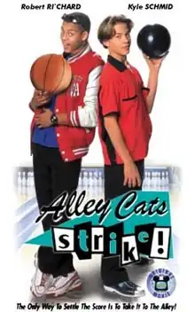 The boy to the left is holding a basketball while the boy to the right is holding a bowling ball. The words "Alley Cats Strike!" appears in front of their legs.