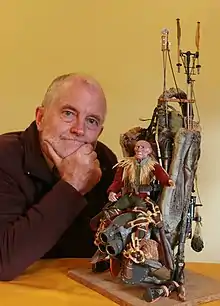 Dougal Dixon with a model of one of his creatures