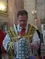 Distribution of Communion at a Tridentine Mass, women typically wear a headcovering.