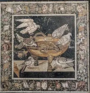 Polychrome Roman mask mascarons on the border of a mosaic with doves drinking from a golden basin, after Sosus of Pergamon, 1st century BC, mosaic, National Archaeological Museum, Naples, Italy