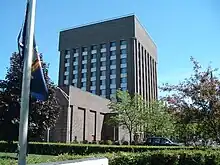 A tall brick cube-shaped building