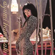 Ayumi Hamasaki with black hair wearing a leopard print outfit that includes a long tail. In lowercase, "ayumi hamasaki" is written vertically on the left edge.