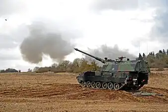 German soldiers with 4th Battery, 131st Artillery Battalion carry out a fire mission with self propelled howitzers.