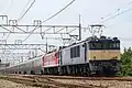 A Cassiopeia cruise train hauled by JR East Class EF64-1000 and EF81 electric locomotives in June 2016