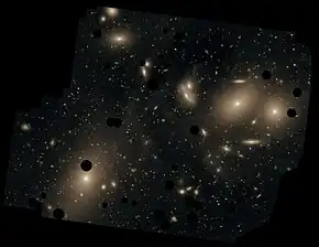 NGC 4402 and other galaxies viewed through the Burrell Schmidt telescope. The black circles were put there to remove bright, foreground stars.