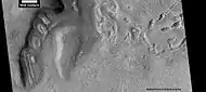 Dipping layers, as seen by HiRISE under HiWish program  Also, Ribbed Upper plains material is visible in the upper right of the picture.  It is forming from the upper plains unit, and in turn is being eroded into brain terrain.