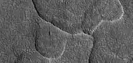 Close-up of scalloped ground, as seen by HiRISE under HiWish program.  Surface is divided into polygons; these forms are common where ground freezes and thaws.  Note: this is an enlargement of a previous image.