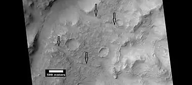 Channels (indicated with arrows), as seen by HiRISE under HiWish program