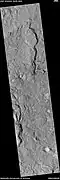 Channel along edge of crater ejecta, as seen by HiRISE under HiWish program.  Arrows show channel.