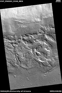 Wide view of surface with spots displaying mantle, as seen by HiRISE under HiWish program