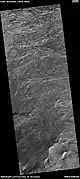 Wide view of layers in Crommelin crater, as seen by HiRISE under HiWish program.  Parts of this photo are enlarged in following images.