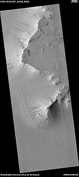 Dark slope streaks along the edge of a pedestal crater, as seen by HiRISE under the HiWish program